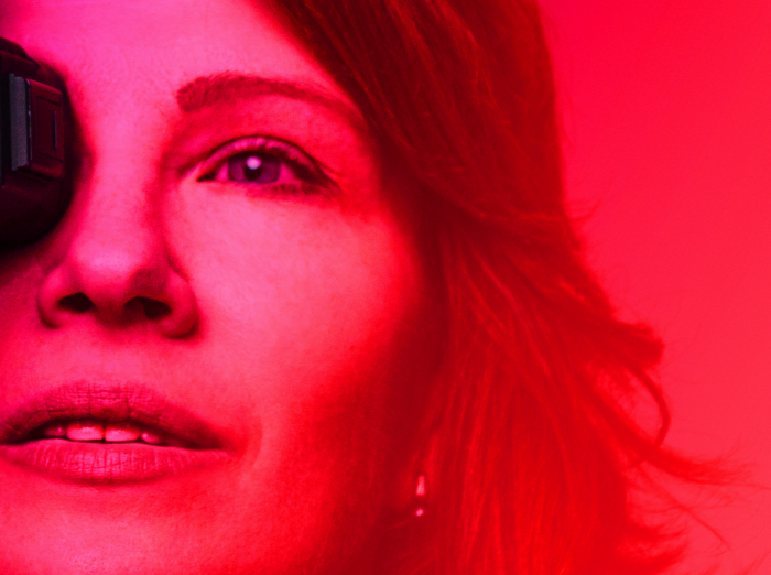 Close-up of a woman in red lighting